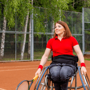 Woman in wheelchair plating tennis