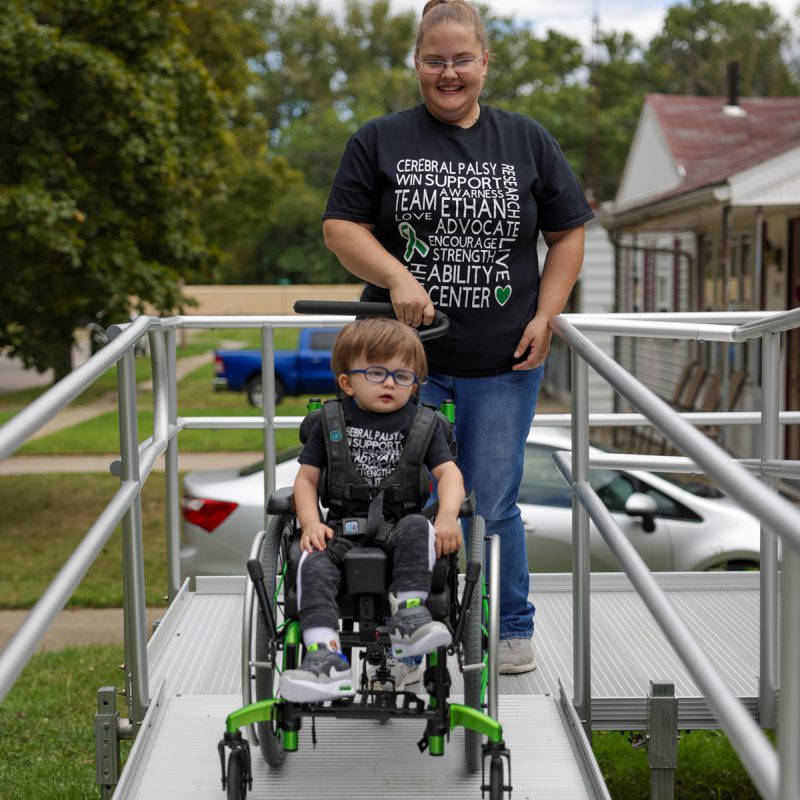 Mom and Son in a wheelchair using ramp